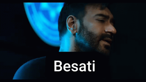 A Man With A Beard Is Standing In Front Of A Blue Background With The Word Besati On It GIF