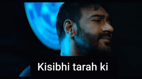 A Man With A Beard Is Standing In Front Of A Blue Background With The Words Kisibi Tarah Ki GIF