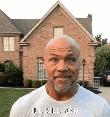 A Man With A Beard Is Standing In Front Of A Brick House And Says `` Ill Kill You '' . GIF