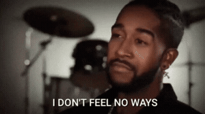 A Man With A Beard Is Standing In Front Of A Drum Set And Saying I Don 'T Feel No Ways . GIF