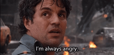 A Man With A Beard Is Standing In Front Of A Fire And Says `` I 'M Always Angry '' . GIF