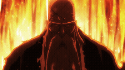 A Man With A Beard Is Standing In Front Of A Fire Background GIF
