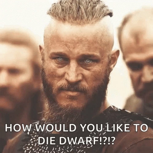 A Man With A Beard Is Standing In Front Of A Group Of Men And Says How Would You Like To Die Dwarf ? GIF