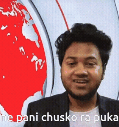 A Man With A Beard Is Standing In Front Of A Map Of The World And Talking . GIF