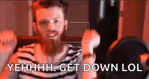 A Man With A Beard Is Standing In Front Of A Microphone And Saying Get Down Lol GIF