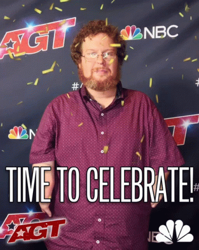 A Man With A Beard Is Standing In Front Of A Nbc Sign GIF