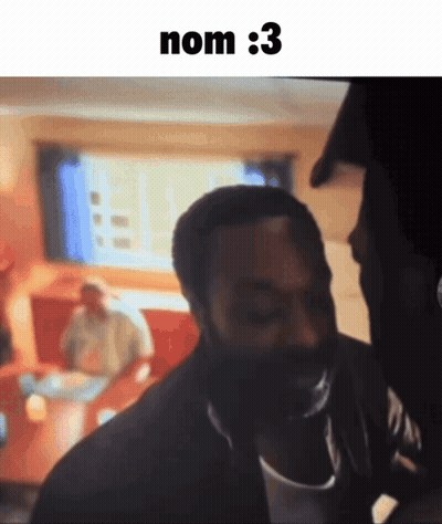 A Man With A Beard Is Standing In Front Of A Screen That Says Nom : 3 On It GIF