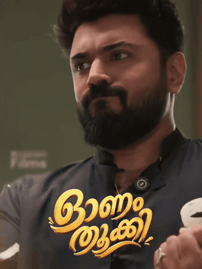 A Man With A Beard Is Standing In Front Of A Sign That Says ' Aa ' On It GIF