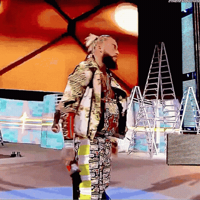 A Man With A Beard Is Standing In Front Of A Sign That Says ' Ethenextthing ' On It GIF