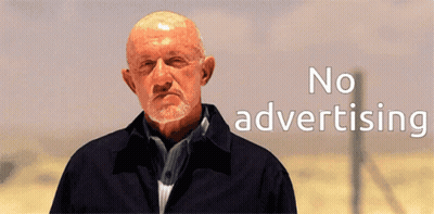 A Man With A Beard Is Standing In Front Of A Sign That Says No Advertising GIF