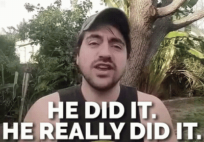A Man With A Beard Is Standing In Front Of A Tree And Says He Did It He Really Did It . GIF