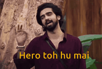 A Man With A Beard Is Standing In Front Of A Tree And Says Hero Toh Hu Mai . GIF