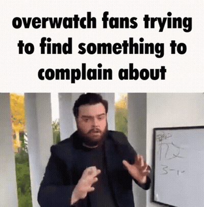 A Man With A Beard Is Standing In Front Of A White Board With The Words `` Overwatch Fans Trying To Find Something To Co GIF