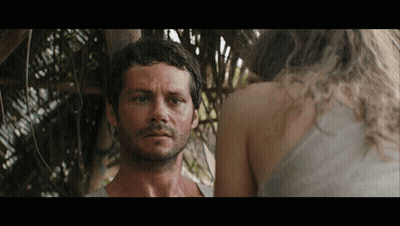 A Man With A Beard Is Standing Next To A Woman GIF