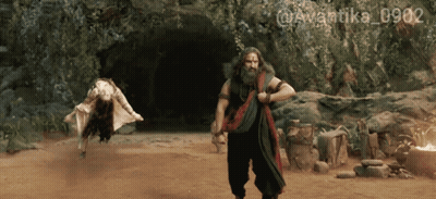 A Man With A Beard Is Standing Next To A Woman In A Cave With The Hashtag @Avantika_0902 GIF