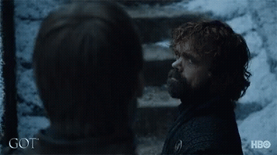 A Man With A Beard Is Standing Next To A Woman With The Word Got On The Bottom Of The Image GIF