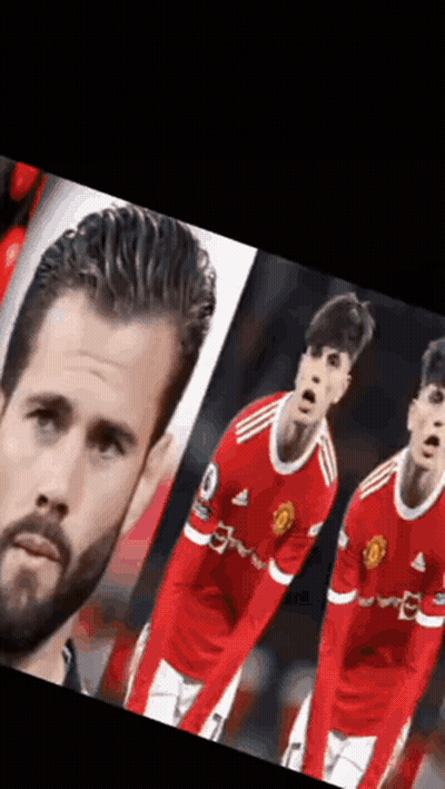 A Man With A Beard Is Standing Next To Two Soccer Players In Red Uniforms . GIF