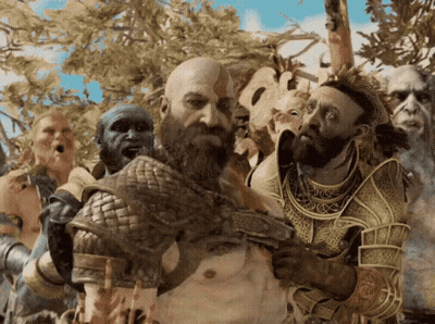 A Man With A Beard Is Surrounded By A Group Of People GIF
