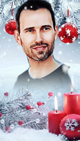 A Man With A Beard Is Surrounded By Candles And Christmas Decorations GIF