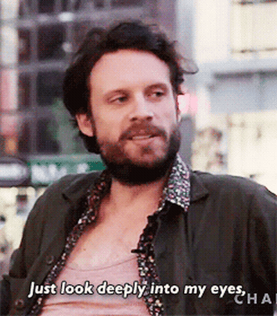A Man With A Beard Is Talking About Looking Deeply Into His Eyes GIF