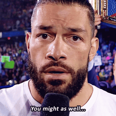 A Man With A Beard Is Talking Into A Microphone And The Words You Might As Well Are Above Him GIF