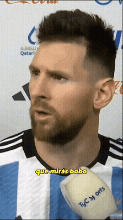 A Man With A Beard Is Talking Into A Microphone Which Says Tyc Sports On It GIF