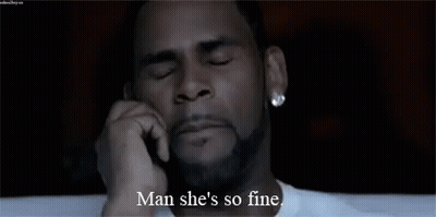 A Man With A Beard Is Talking On A Cell Phone And Saying Man She 'S So Fine . GIF