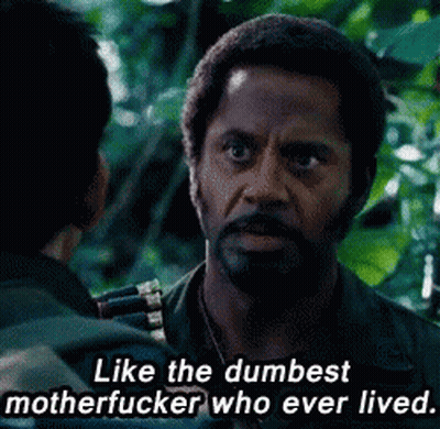 A Man With A Beard Is Talking To Another Man With A Caption That Says Like The Dumbest Motherfucker Who Ever Lived GIF