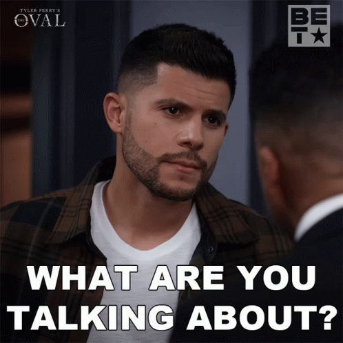 A Man With A Beard Is Talking To Another Man With The Words What Are You Talking About Below Him GIF