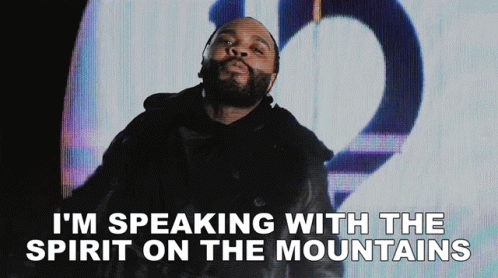 A Man With A Beard Is Talking With The Spirit On The Mountains GIF