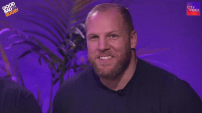 A Man With A Beard Is Waving His Hand And Saying Hi Mum . GIF