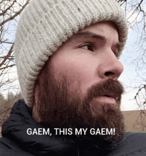 A Man With A Beard Is Wearing A Beanie And Says " Gaem This My Gaem " GIF