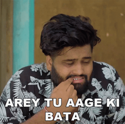 A Man With A Beard Is Wearing A Black And White Floral Shirt And Says " Arey Tu Aage Ki Bata " GIF