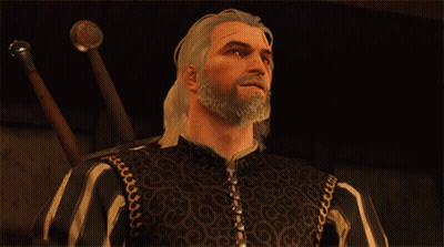 A Man With A Beard Is Wearing A Black And White Striped Jacket GIF