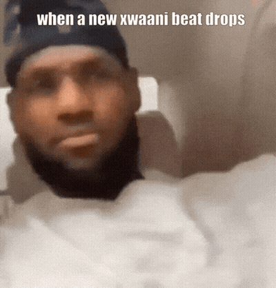 A Man With A Beard Is Wearing A Black Hat And A White Shirt With The Caption When A New Kwaani Beat Drops GIF