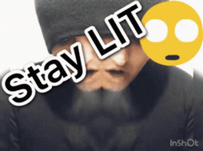 A Man With A Beard Is Wearing A Black Hat And Has The Words Stay Lit On His Face GIF