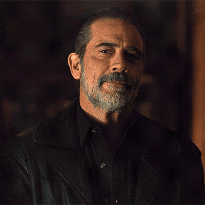 A Man With A Beard Is Wearing A Black Shirt And A Leather Jacket GIF
