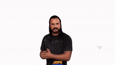 A Man With A Beard Is Wearing A Black Shirt And Giving A Thumbs Up Sign . GIF
