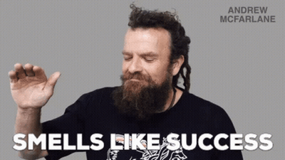 A Man With A Beard Is Wearing A Black Shirt That Says Andrew Mcfarlane GIF