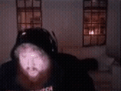 A Man With A Beard Is Wearing A Black Shirt That Says Angel Beard Man GIF