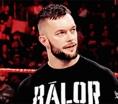 A Man With A Beard Is Wearing A Black Shirt That Says ' Halor ' On It GIF