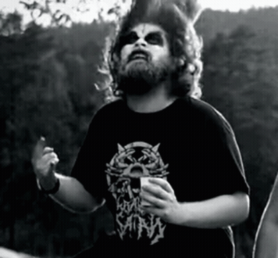A Man With A Beard Is Wearing A Black Shirt With A Cat On It And The Word Satan On It GIF