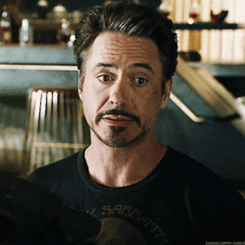 A Man With A Beard Is Wearing A Black Shirt With The Word Sabbath On It GIF