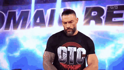 A Man With A Beard Is Wearing A Black T-Shirt That Says Gtc . GIF