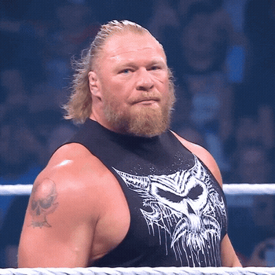 A Man With A Beard Is Wearing A Black Tank Top With A White Skull On It GIF