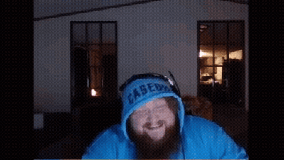 A Man With A Beard Is Wearing A Blue Hoodie That Says ' Lakers ' On The Front GIF