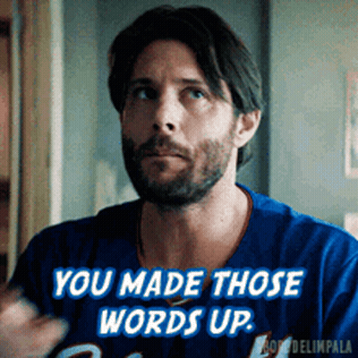A Man With A Beard Is Wearing A Blue Jersey That Says " You Made Those Words Up " GIF