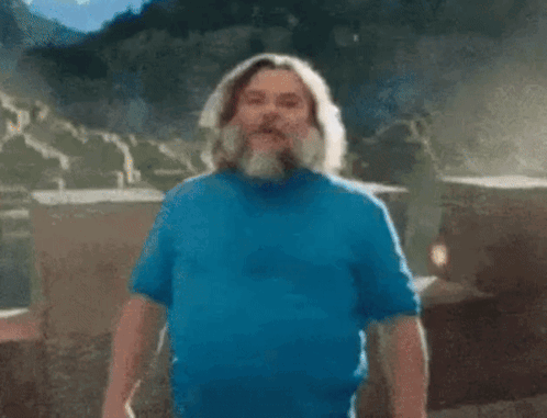 A Man With A Beard Is Wearing A Blue Shirt And Saying I Am GIF