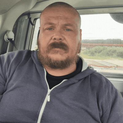 A Man With A Beard Is Wearing A Blue Sweatshirt GIF