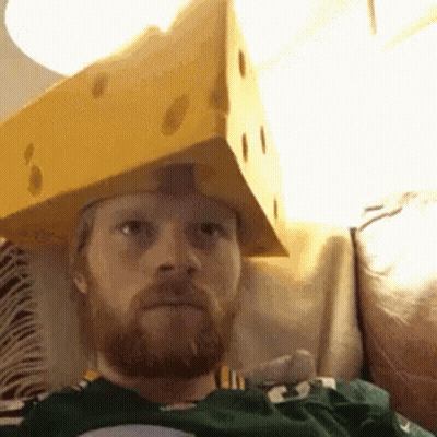 A Man With A Beard Is Wearing A Cardboard Box On His Head GIF